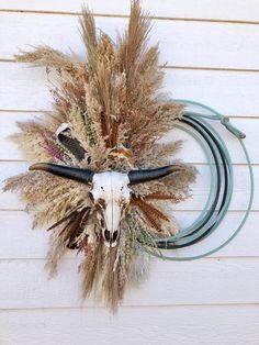 Elevate your home decor with our rope wreath, a stunning piece of western wall art featuring an Aztec cow skull design. This lasso wreath adds a rustic touch to any farmhouse decor, perfect for enhancing your living room with a unique western longhorn sign. KEY FEATURES *Approximate Dimensions: 1.38" H x 19.63" W x 4.31" D* Bull Head  * Choose your florals  RUSH MY SHIPPING USE THIS LINK! https://jamesonropeandco.etsy.com/listing/1691702946/rush-my-shipping CUSTOMIZE MY WREATH  https://jamesonro Dining Room Western Decor, Ranch Room Decor, Lasso Rope Decor, Western Christmas Wreaths, Boho Western Office Decor, Western Theme Living Room Ideas Rustic, Rope Wreath Diy Western, Western Fall Decor Ideas, Wall Art Western