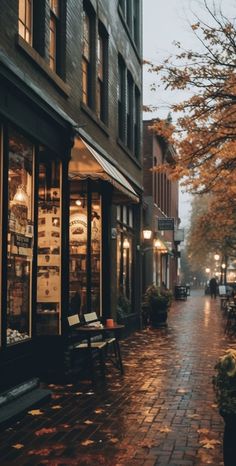 an empty street with benches and tables on it