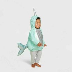 a little boy in a costume that looks like a fish