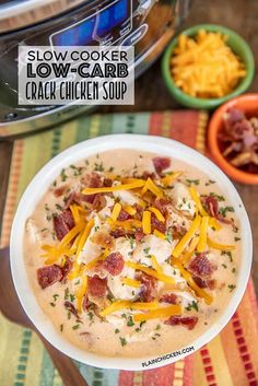 slow cooker low carb cracker soup in a bowl with cheese and bacon on top