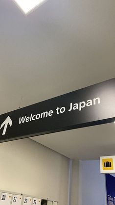 a welcome to japan sign hanging from the ceiling