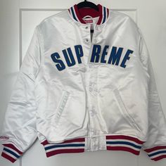 Supreme Bomber Jacket Size Medium Never Been Worn Mint Condition White Hooded Varsity Jacket With Ribbed Cuffs, Winter White Varsity Jacket With Ribbed Cuffs, Casual White Varsity Jacket For Winter, White Hooded Varsity Outerwear, White Hooded Varsity Jacket For Fall, White Sporty Hooded Varsity Jacket, White Winter College Outerwear, Casual White Outerwear For College, White Varsity Winter Outerwear