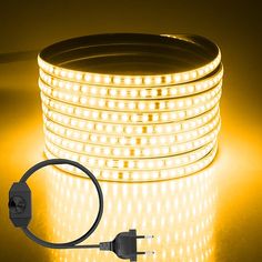 an image of a yellow led strip light on a table with the cord plugged in