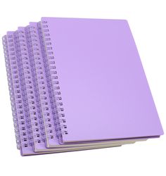 three spiral bound notebooks with purple paper on each side and one in the middle