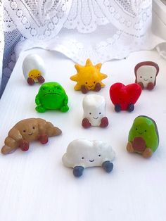 there are many small toy animals on the bed together, including one with a star