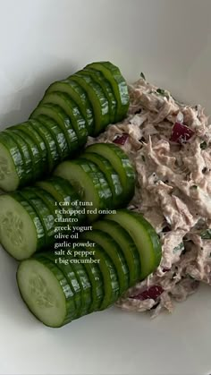 cucumber slices and tuna salad in a white bowl with the title above it