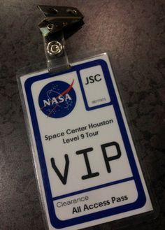 a nasa space center houston level 3 tour id badge on a lanyard keychain