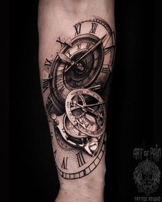 a black and white tattoo with a clock on it's arm that has roman numerals