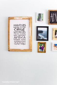 the wall is covered with many different framed photos, including pictures and words on it