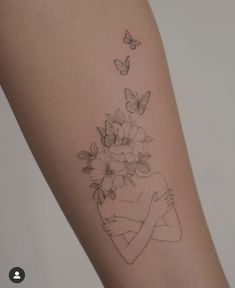 a woman's arm with flowers and butterflies on the left side of her body