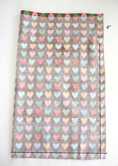 a piece of fabric with hearts on it