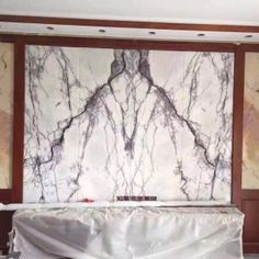 a large marble wall in the middle of a room