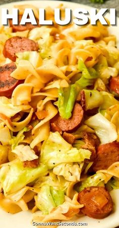 sausage and pasta salad on a white plate with the words haluski above it