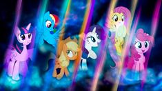 many different colored ponys standing together in front of a black background with blue and pink lights