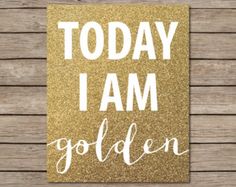 a gold card with the words today i am golden written in white ink on it