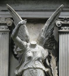 an angel statue is shown in front of a column with columns and pillars around it