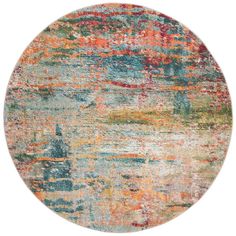 a round rug with multicolored paint on the inside of it and an orange, blue