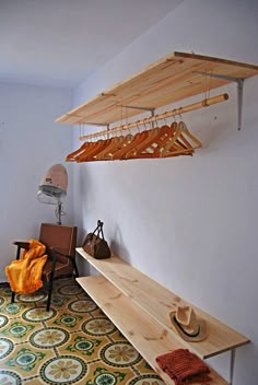 a room that has some wooden shelves on the wall