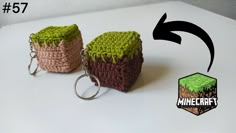 two crocheted keychains sitting next to each other on a white surface