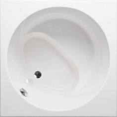 an oval shaped bathtub with two faucets on the side and one in the center