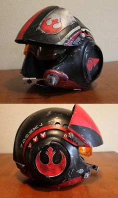 the helmet is black and red with a star wars symbol on it's side