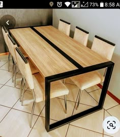 a wooden table with six chairs around it