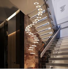 a staircase with many lights hanging from it