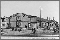 an old black and white photo of people walking in front of a train station with carriages