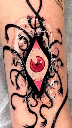 an artistic tattoo on the leg of a woman