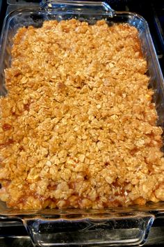 a casserole dish filled with oatmeal toppings on top of a stove