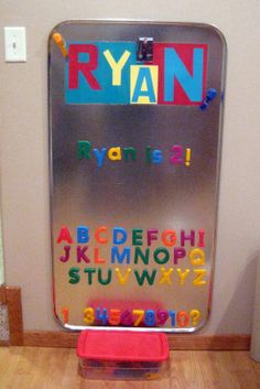 a metal sign with letters and numbers on it in front of a door that says ryan