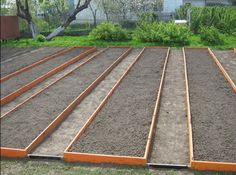 the ground is being prepared to be laid out for planters and flower pots in the yard