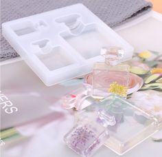 an assortment of perfumes are displayed on a table