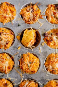 an overhead view of some food on a baking sheet with utensils in it