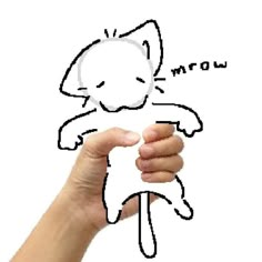 a hand holding up a drawing of a cat with the word meow above it