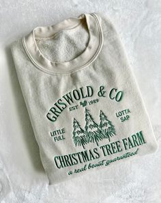 "Griswold Christmas Holiday Embroidered Sweatshirt. Clark would love this! If you want a different thread color please message us first and put your color change request in the \"Buyers Notes\" during checkout. Material: 100% Cotton Ribbed Neckline, hem and cuffs Fit: Shirts are UNISEX MEN: Order Regular Size WOMAN: Order 1 Size down for tighter fit Care: Wash with like colors using warm water. Tumble dry medium or low." Fitness Christmas Shirts, Embroidered Cotton Christmas Sweatshirt, Christmas Cotton Sweatshirt With Embroidered Logo, Christmas Cotton Top With Embroidered Text, Holiday Embroidered Cotton Top, Holiday Sweatshirts, Griswold Christmas, Christmas Parade, Christmas Tshirt