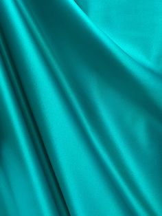 A beautiful, teal blue, matte, brushed satin that is made of 100% polyester. High quality, durable, and machine washable. This fabric also passes NFPA 701 for flame retardancy. Sold by the yard. (1 yard= 36 in.) Width is 60 in. All orders will be cut in one continuous piece. Free shipping in US. For any large or wholesale orders, message us. Thank you for your time and business! Torquise Blue Color, Blue Teal Aesthetic, Teal Blue Aesthetic, Teal Clothes, Teal Color Background, Clothing Fabric Patterns, Teal Aesthetic, Skin Palette, Turquoise Aesthetic