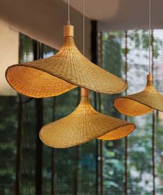 three bamboo lamps hanging from the ceiling