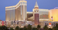 the las vegas hotel and casino is lit up at night