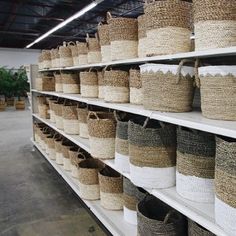 baskets are lined up on shelves in a store