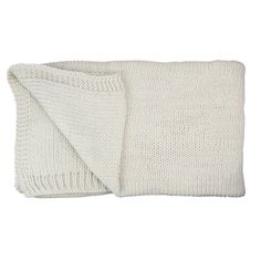 a white knitted blanket folded on top of each other