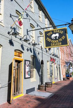 a sign on the side of a building that says he horse town saloon