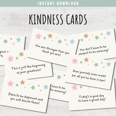 some kind of card that is on top of a wooden table with the words kindness cards written