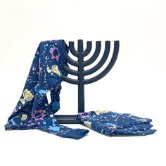 a menorah and two scarves on a white background with a hanukkah