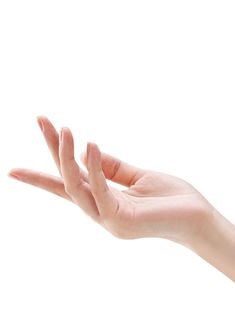 a person's hand reaching out to catch something in the air on a white background