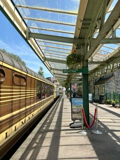 the train is stopped at the station waiting for passengers