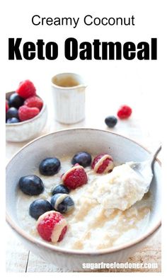 a bowl of oatmeal topped with berries and blueberries