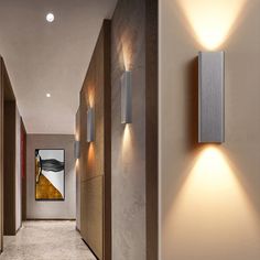 a long hallway with two lights on the wall