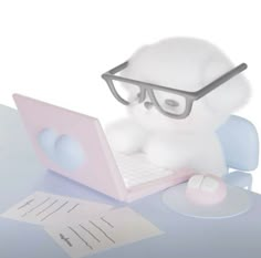 a stuffed animal wearing glasses using a laptop computer