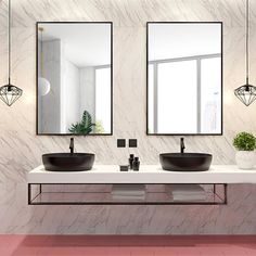 a bathroom with two sinks and mirrors on the wall